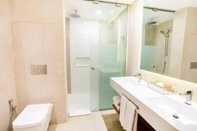 a bathroom with a sink and a shower and a toilet at Iberostar Selection Coral Bavaro - All Inclusive in Punta Cana