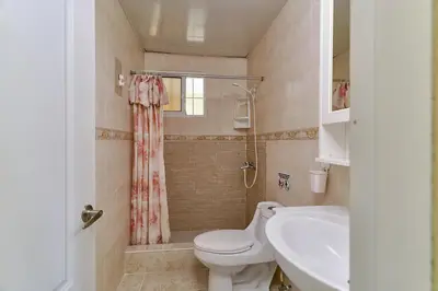 a bathroom with a toilet and a sink at Parco del Caribe in Boca Chica