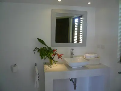 a bathroom with a sink and a mirror at Villa Noria in Las Terrenas