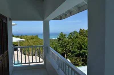 a balcony with a view of the ocean at Villa Noria in Las Terrenas