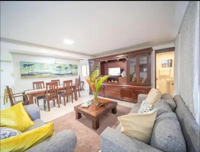 a living room with a couch and a table at Home W Private Hot Tub, Near Everything in Sosua Center in Sosúa