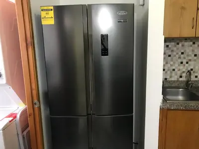 a stainless steel refrigerator in a kitchen next to a sink at CONFORTABLE first floor en santiago RD in Santiago de los Caballeros
