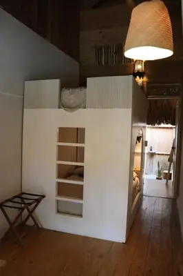 a bedroom with a bunk bed in a room at Bungalow with pool and Air Conditioning near playa Macao in Punta Cana