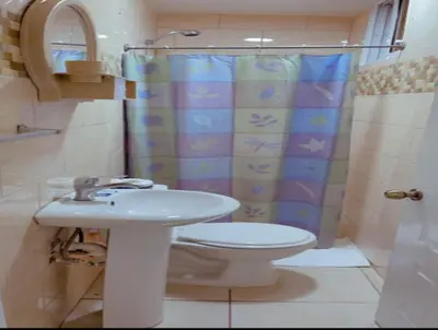 a bathroom with a sink and a toilet and a shower at Fully Equipped New 3br Apt dt 2mins To The Beach in Sosúa