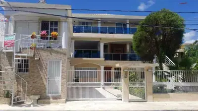 an image of a house with a gate at Fully Equipped New 3br Apt dt 2mins To The Beach in Sosúa