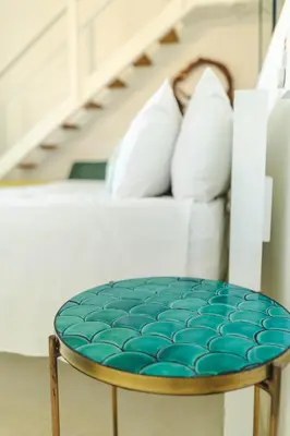a coffee table in front of a white couch at PUNTA POPY BOUTIQUE HOTEL - Adults Only in Las Terrenas