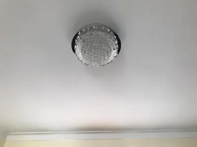 a ceiling light on a white ceiling at cómodo first floor in Santiago de los Caballeros