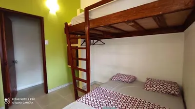 a bedroom with two bunk beds and a ladder at Private Rooms-Art Punta Cana in Punta Cana