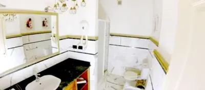 a white bathroom with a sink and a toilet at Sea View Apartment in Boca Chica, 50 m², Air Conditioning in Boca Chica