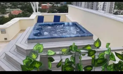 a pool of water on the side of a building at Elegant apartment with Jacuzzi in Boca Chica - 200 m² in Boca Chica