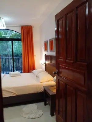 a bedroom with a bed and a large window at Espectacular Apartamento con Vista al Mar Solo Adultos in La Laguna