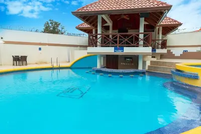 a pool at a resort with a water slide at Hotel Silvestre in La Romana