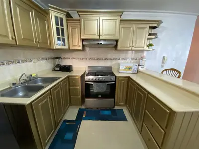 a small kitchen with a sink and a stove at Santo Domingo Paradise V - #211 in La Estrella