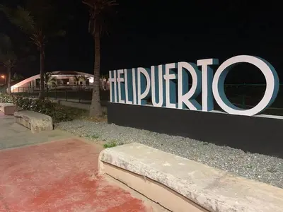 a large sign that says hiltirride at night at Cozy Private Room in El Malecn, Santo Domingo in Santo Domingo