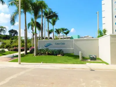 a sign for the ocean club with palm trees at Verano 2019 in Santiago de los Caballeros