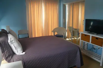 a bedroom with a bed and a flat screen tv at The blue lagoon of the Caribbean Sea. Velero 205.Cadaques Caribe in La Fragata