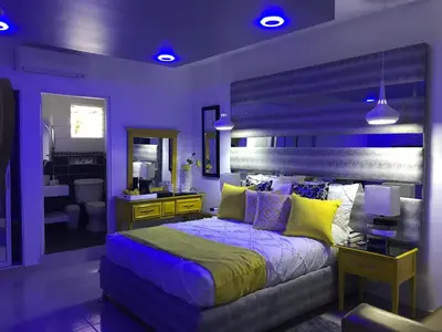 a bedroom with a large bed and a bathroom at Hotel Rey in Concepción de La Vega