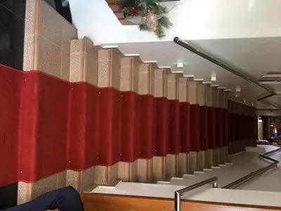 a staircase in a building with a red and white wall at Hotel Rey in Concepción de La Vega