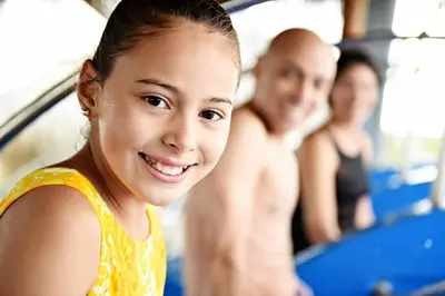 a young girl and a man in a bus at Royalton Punta Cana, An Autograph Collection All-Inclusive Resort & Casino in Punta Cana