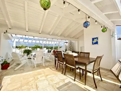 a dining room with a table and chairs at Unique Luxury Pent House At Marina Casa De Campo in La Romana