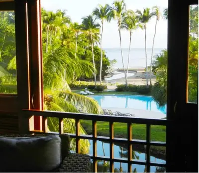 a view of a swimming pool from a resort window at Penthouse Las Playas in Las Terrenas