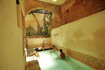 a group of children playing in a tub in a room at FIXIE LOFTS - Colonial Villa Suites with Pool in Santo Domingo