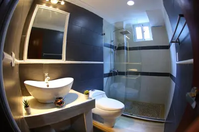 a bathroom with a sink and a toilet and a shower at Hotel Vicentina in Boca Chica