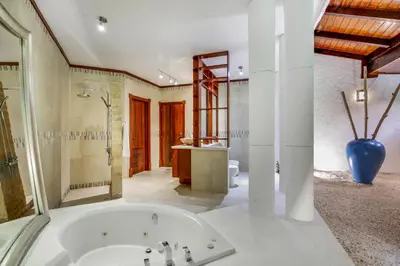 a large bathroom with a tub and a sink at Moroccan-Style Paradise with Pool & Maid at Casa de Campo in La Romana