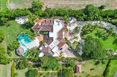 an aerial view of a mansion with a pool at Moroccan-Style Paradise with Pool & Maid at Casa de Campo in La Romana