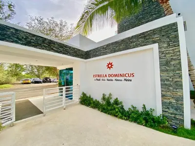a sign on the side of a building with a garage at Beautiful Apt Dominicus Bayahibe, Walk To Beach! in La Laguna