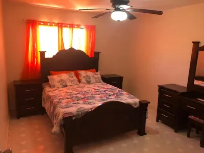 a bedroom with a bed and a ceiling fan at La Gaviota A3 in Juan Dolio