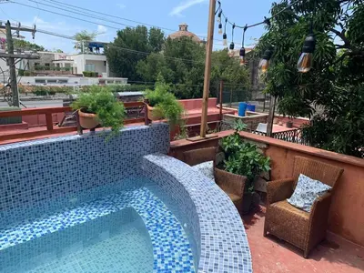 a swimming pool on the roof of a building at Mansion Colonial Boutique Hotel Pool Jacuzzi Bar Restaurant by BTC Group Crypto in Santo Domingo