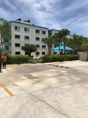 a large parking lot in front of a building at La Gaviota B1 in Juan Dolio