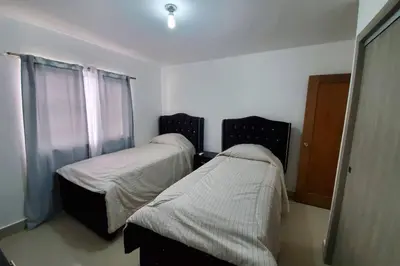 a hospital room with two beds and a window at Hanly Roger's Brand new place in San Felipe de Puerto Plata