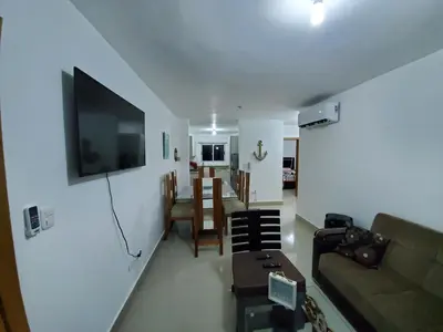 a living room with a couch and a tv on a wall at Hanly Roger's Brand new place in San Felipe de Puerto Plata