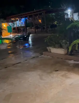 a park bench sitting in the rain at night at Best ocean view Sosua-Cabarete in Sosúa