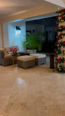 a living room with a christmas tree and a couch at Best ocean view Sosua-Cabarete in Sosúa