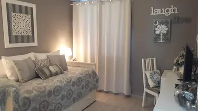 a bedroom with a bed and a table and a chair at Apartamento Estrella Dominicus in La Laguna