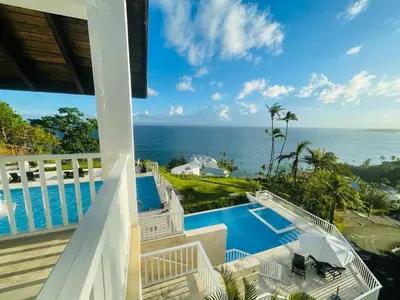 a view of the ocean from the balcony of a house at Vista Mare Samana Amazing Views!! in Santa Bárbara de Samaná