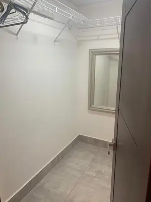 a white room with a mirror and a door at Amazing Rooftop and Best View of the City in Santiago de los Caballeros