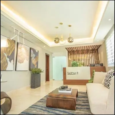 a living room with a couch and a coffee table at Amazing Rooftop and Best View of the City in Santiago de los Caballeros