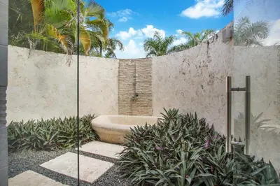 a bathroom with a bath tub in a wall at Stunning Villa with Private Pool and Jacuzzi in Casa de Campo in La Romana