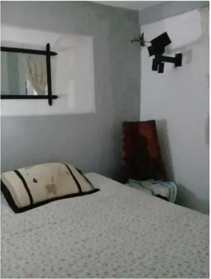 a bedroom with a bed with a pillow on it at Villa Julirous Rd, spa and aparthotel camp for vacationers in Boca Chica