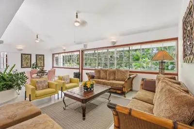 a living room with couches and a table at Amazing Villa in Casa de Campo with Included in Price Maid and Waiter in La Romana