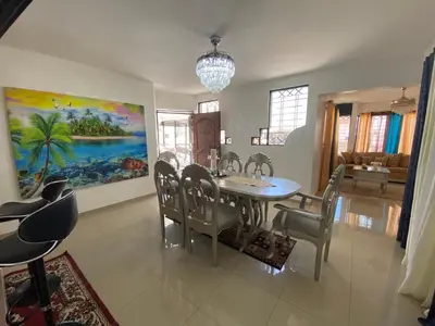 a dining room with a table and chairs at Santiago City Center Huge nice Apartment to stay rooftop to enjoy the city view in Santiago de los Caballeros