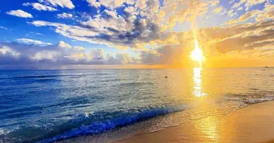 a sunset on the beach with the sun setting at Vanilla House in Bayahibe