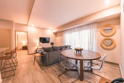 a living room with a couch and a table at Fully Serviced Apartment at Regatta Living - 2C in Santo Domingo