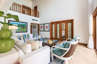 a living room with a couch and chairs and a table at The Greatest 3BR Villa at Puerto Bahia in Los Grini