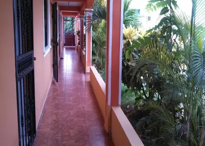 a hallway of a house with plants on it at Apartahotel Next Nivel - Queen room with Ac in Punta Cana