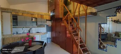 a kitchen with a spiral staircase in a room at Private Study Punta Cana in Punta Cana
